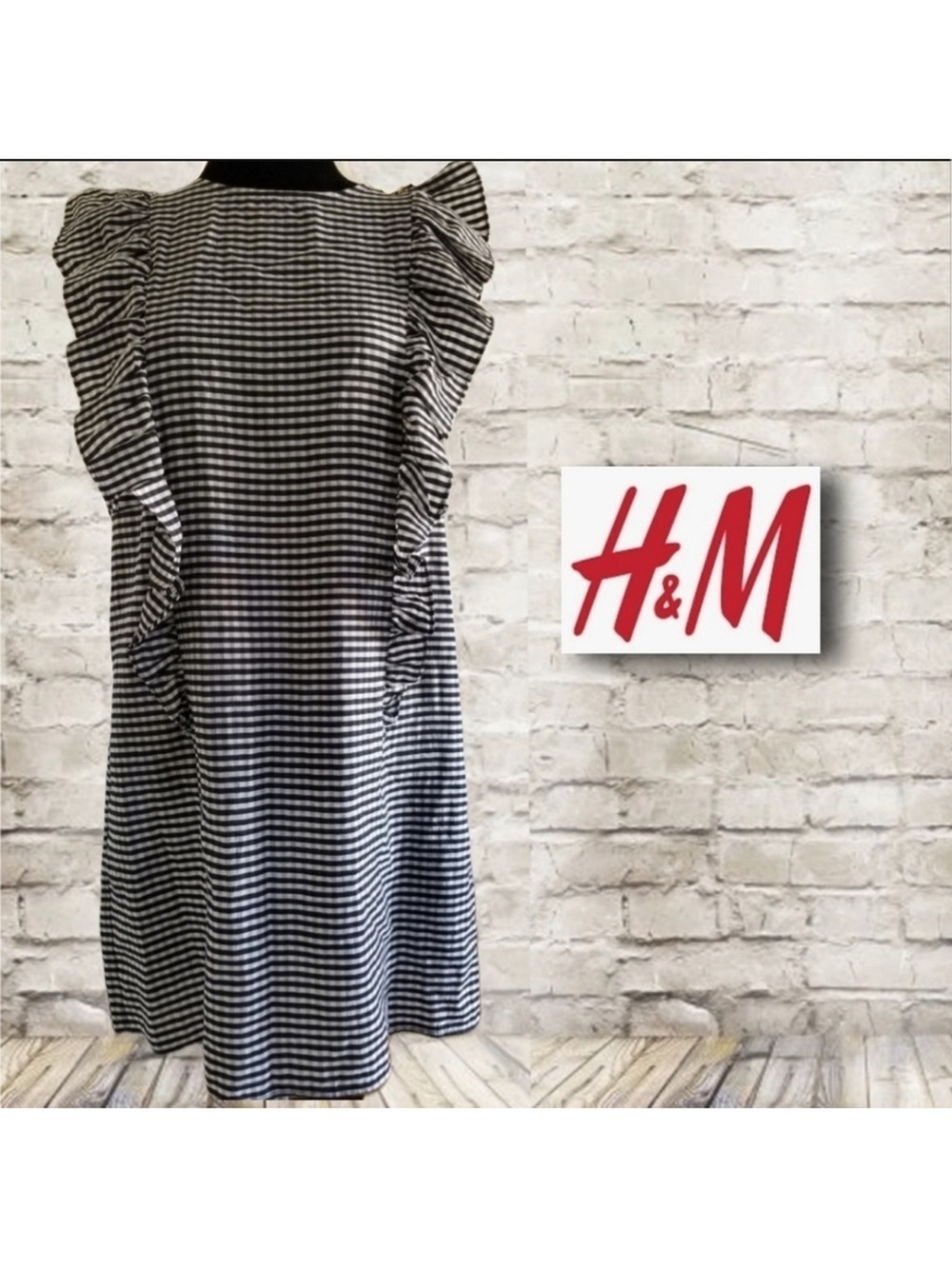 H&M black and white king knee length dress with ruffle sleeves, pockets size 8.